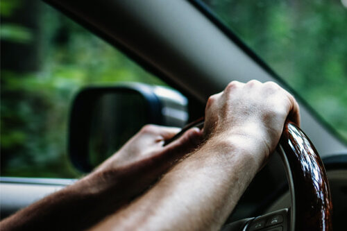 autoinsshopping hands on steering wheel